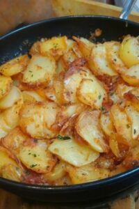 Skillet fried potatoes and onions golden and crispy