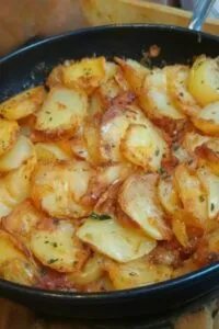 Skillet fried potatoes and onions golden and crispy