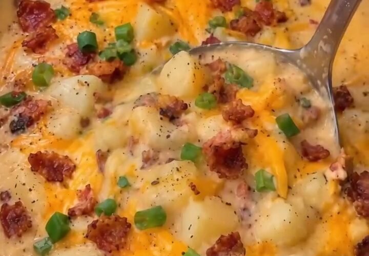 Creamy crockpot potato soup topped with bacon cheddar and sliced green onions