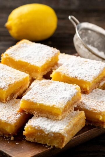 Homemade lemon bars with buttery shortbread crust and powdered sugar