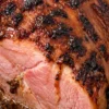 Slow cooker cola ham with caramelized glaze and juicy pink slices